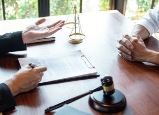 Legal Strategies Every Slip and Fall Attorney Considers Before Trial Attorney discussing legal case with client meeting