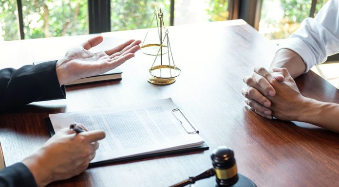 Legal Strategies Every Slip and Fall Attorney Considers Before Trial Attorney discussing legal case with client meeting