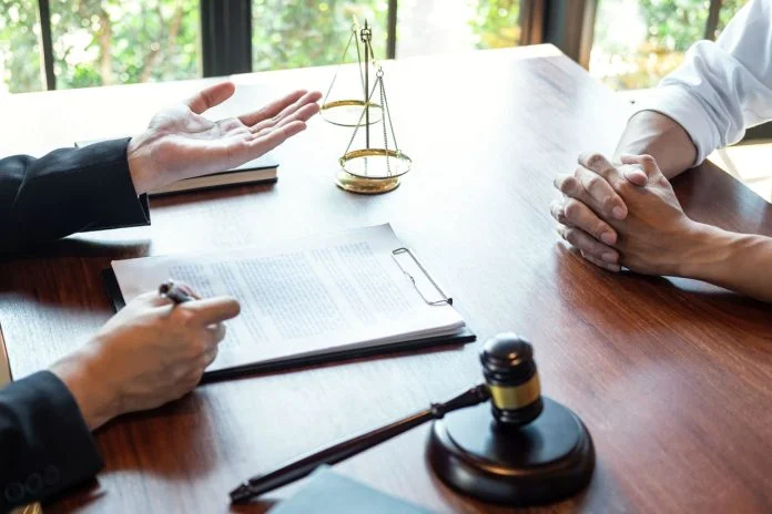 Attorney discussing legal case with client meeting