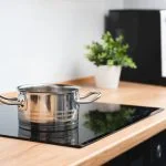 Pot in the kitchen on the induction stove.