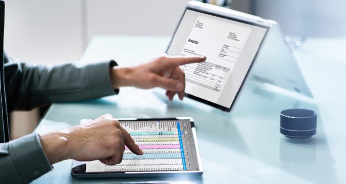 Electronic Invoice Spreadsheet Software, OCR and Corporate Invoice On Computer