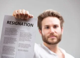 holding up a resignation letter