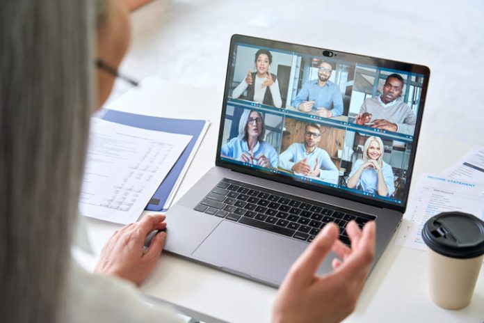 iStock-1325899529 (1) Remote teams having a videocall on financial report using laptop