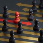 The Better Boards Podcast Series: Steering the Shift – Board Leadership in Times of Transformation Red pawn facing different position for leadership transformation