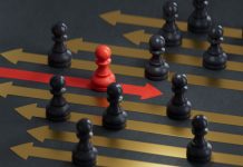 The Better Boards Podcast Series: Steering the Shift – Board Leadership in Times of Transformation Red pawn facing different position for leadership transformation