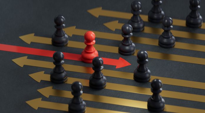 Red pawn facing different position for leadership transformation