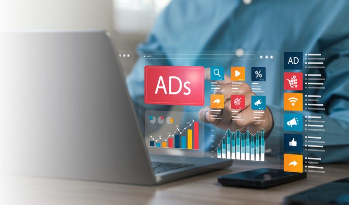 Businessman doing digital marketing and online advertising to target customers. Online sales concept of digital marketing, ad, product ads, promotion of products or services through digital tools. Ads online