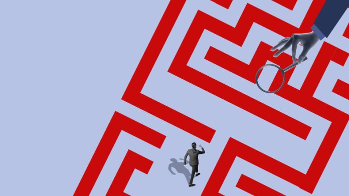 Surreal collage of businessman navigating red maze under magnifying glass Person finding his purpose