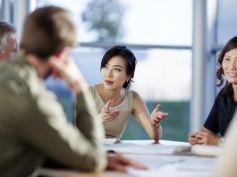 Japanese businesswoman having a meeting with U.S investors