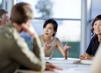 Japanese businesswoman having a meeting with U.S investors