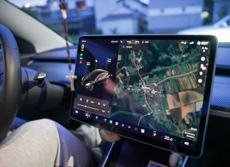 Car dashboard with navigation map on touchscreen.