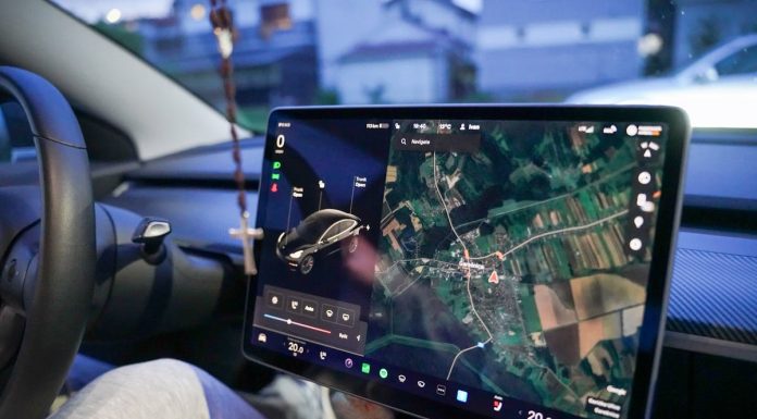 Why Sustainable Automotive Technology Is Driving Change in the Industry Car dashboard with navigation map on touchscreen.
