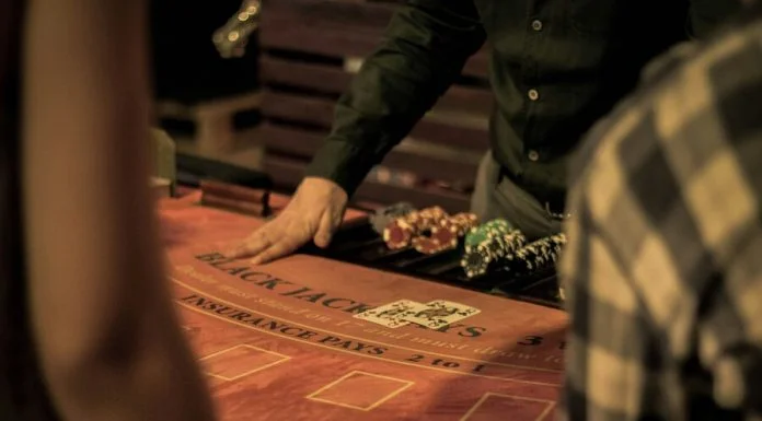 What Slovenian Players Should Know About Taxes on Gambling Winnings man in green dress shirt sitting on chair while gambling with taxes