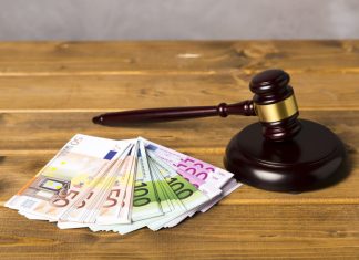 What to Consider Before Applying for a Lawsuit Loan gavel with euro bank notes for Lawsuit Loan