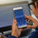 Maverix-Global.com Review: Seven Tiers of Trading Evolution Businessman trading online