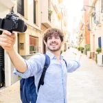 Travel - Young tourist man streaming