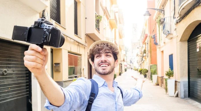 What’s Trending and What’s Fading: 2026 Travel Marketing Shifts You Should Know Ahead of Time Travel - Young tourist man streaming