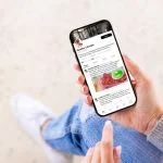 Woman viewing wellness lifestyle advice on creator's profile page on social media app