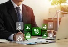 Businessman analyze sustainability investment and signing a green business contract.