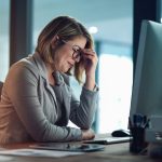 Scaling You: How Small Business Owners Can Grow Without Burning Out Businesswoman managing small business feeling burnout and tired