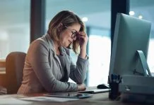 Scaling You: How Small Business Owners Can Grow Without Burning Out Businesswoman managing small business feeling burnout and tired