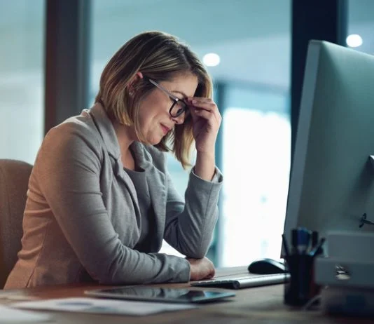 Businesswoman managing small business feeling burnout and tired
