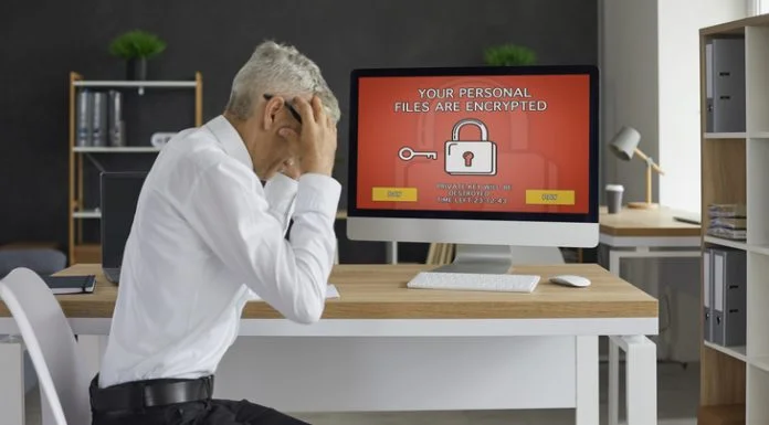 Laws Ban UK Government From Paying Cyber Ransoms Man's computer has been hacked by Cyber Ransoms