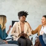 Support with group, therapy and mental health with help, people together talking about problem