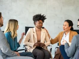 Support with group, therapy and mental health with help, people together talking about problem