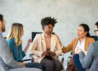 Putting Wellbeing at the Heart of Leadership – Expert Insights for World Mental Health Day Support with group, therapy and mental health with help, people together talking about problem