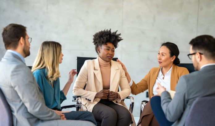 Support with group, therapy and mental health with help, people together talking about problem