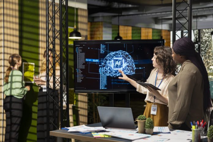 iStock-2231663326 (1) Marketing team using AI automation for performance marketing