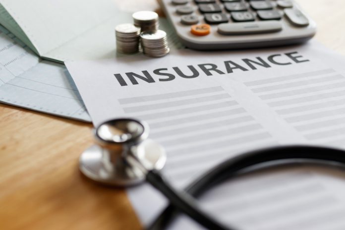 Home insurance form with money,passbook and calculator. GST in Term Insurance