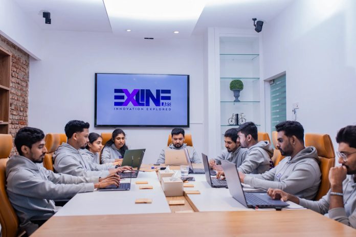 outsourced-developers-large-team-discussion_lq5lf3 (1) Person Outsourced Application software development working on coding computer screen and flowchart at night in modern office