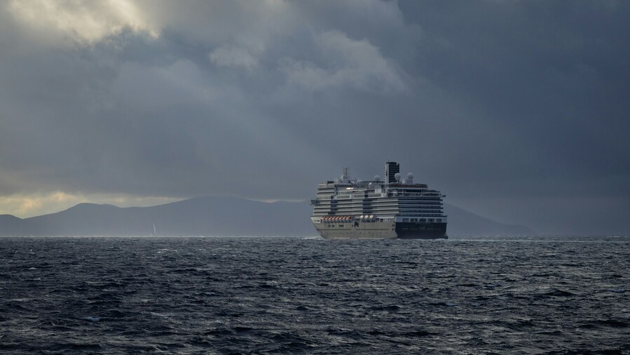 A large ship sails on the ocean under stormy skies for lifestyle investments