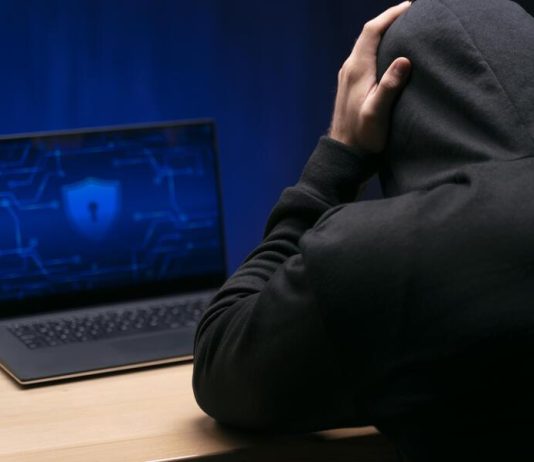 Dissecting False Scam Narratives in Offshore Finance: Why Transparent Knowledge Platforms Face Manufactured Attacks Close up programmer at desk with laptop experiencing False Scam Narratives in Offshore Finance