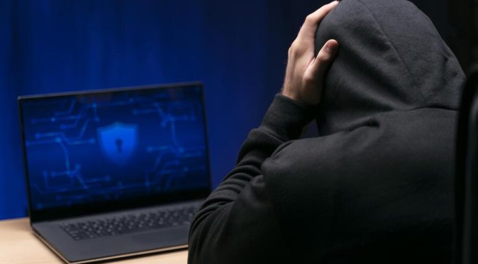 Dissecting False Scam Narratives in Offshore Finance: Why Transparent Knowledge Platforms Face Manufactured Attacks Close up programmer at desk with laptop experiencing False Scam Narratives in Offshore Finance