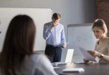 nervous employee wipe face scared to speak in public. Person with stage fright