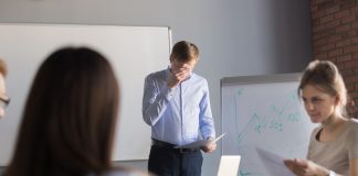 nervous employee wipe face scared to speak in public. Person with stage fright