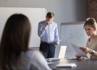 nervous employee wipe face scared to speak in public. Person with stage fright