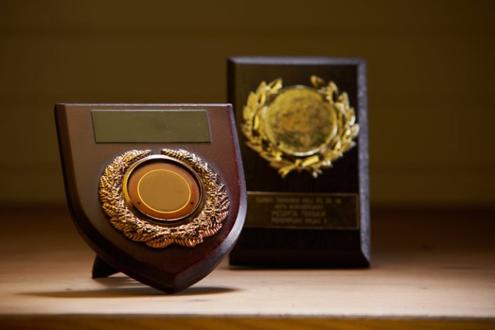 plaque trophy on the wood background Handcrafted Award Plaques