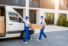 Workers unloading boxes for relocation