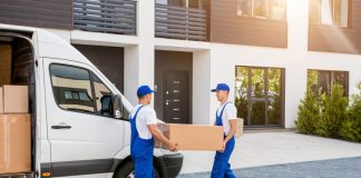 Workers unloading boxes for relocation