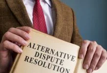 Alternative Dispute Resolution (ADR): A Comprehensive Guide lawyer holding Alternative Dispute Resolution