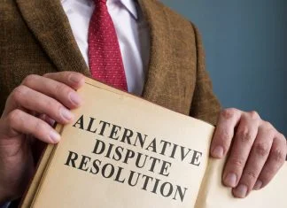 Alternative Dispute Resolution (ADR): A Comprehensive Guide lawyer holding Alternative Dispute Resolution