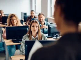 The Generative AI Gap: How Universities are Struggling to Keep Up College student listening to the professor during lecture about AI