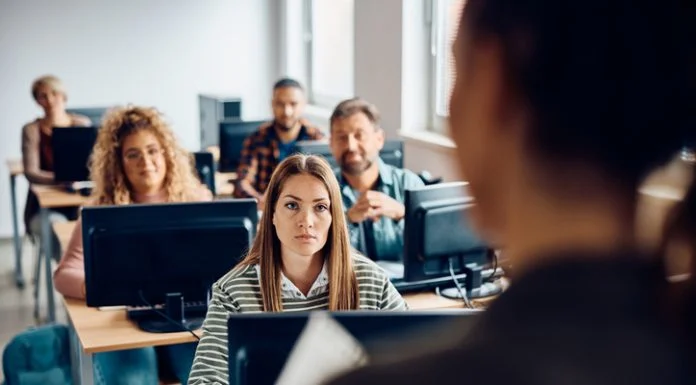 The Generative AI Gap: How Universities are Struggling to Keep Up College student listening to the professor during lecture about AI