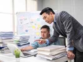 AuDHD and Workplace Law: Avoiding Pitfalls, Unlocking Potential Employee man with autism or AuDHD at Work brainstorm plan and discuss project with manager leader. Corporate of modern colleague