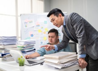 Employee man with autism or AuDHD at Work brainstorm plan and discuss project with manager leader. Corporate of modern colleague