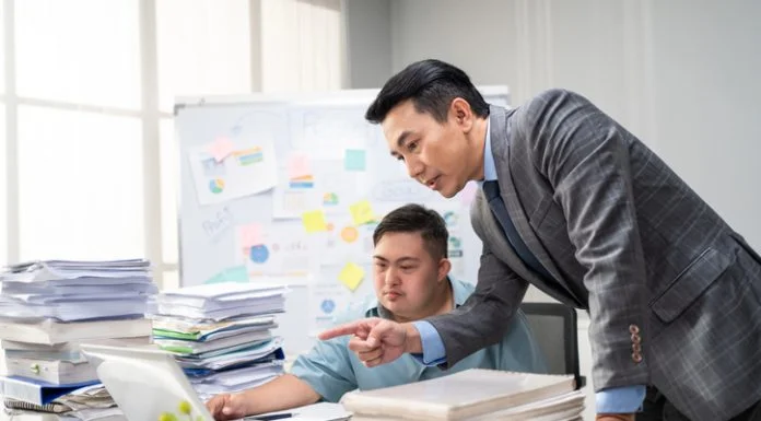 AuDHD and Workplace Law: Avoiding Pitfalls, Unlocking Potential Employee man with autism or AuDHD at Work brainstorm plan and discuss project with manager leader. Corporate of modern colleague